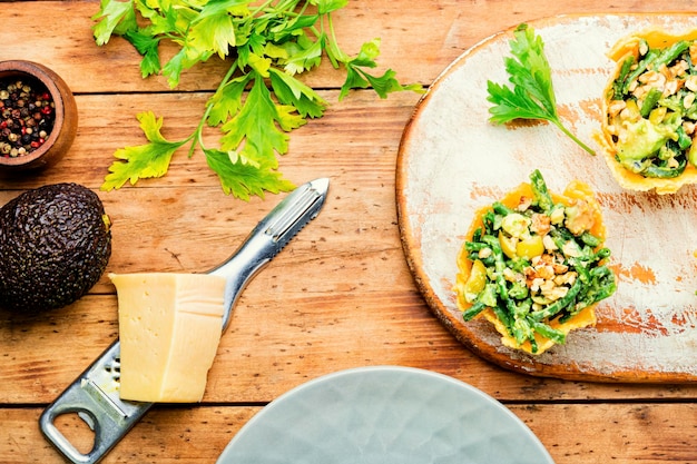 Appetizing cheese basket with avocado,cowpea and nuts.Banquet,holiday food