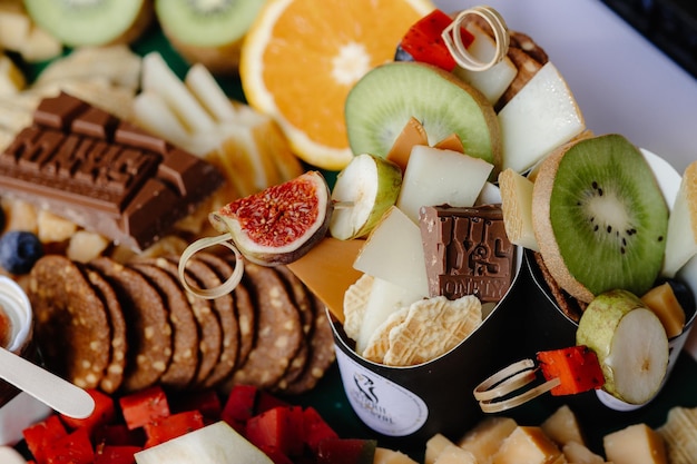 Appetizing cheese in combination with fruit and biscuits