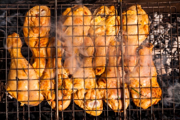 Appetizing chicken legs on the grillBBQ