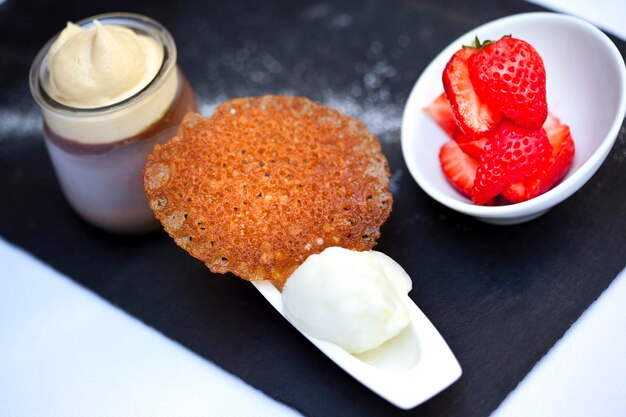 Appetizing dessert on a black slate