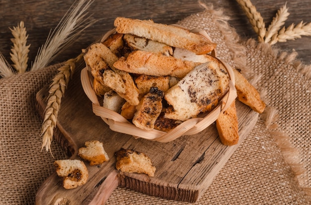 Appetizing fresh white bread croutons on wooden background