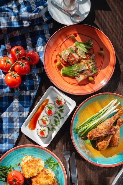 Appetizing homemade sushi rolls on the table in a beautiful setting, sunny lighting