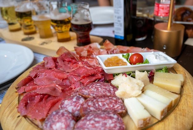 An appetizing platter of cold cuts and assorted cheeses with trentino specialties such as speck