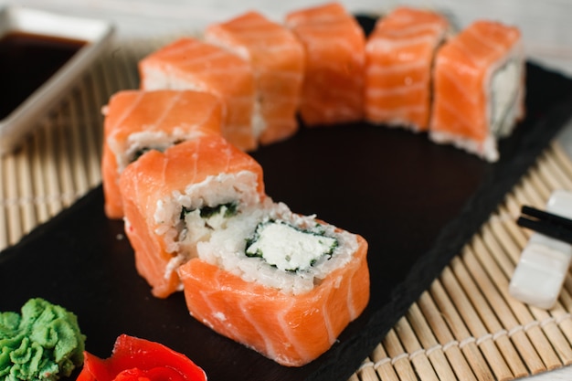 Appetizing salmon rolls. Japanese sushi, closeup.