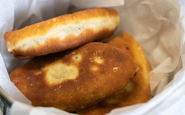 Appetizing savory fried pies Traditional fresh freshly made homemade stuffed pies also known as pastel Rustic fried yeast dough pies