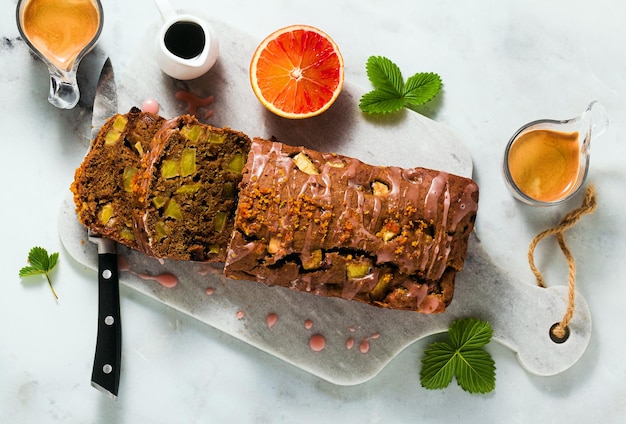 Apple homemade vegan loaf cake with icing and espresso coffee healthy morning breakfast or snack