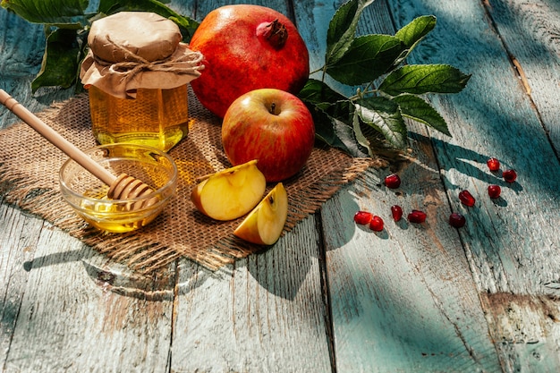 Apple and honey and pomegranate, traditional food of jewish New Year - Rosh Hashana.