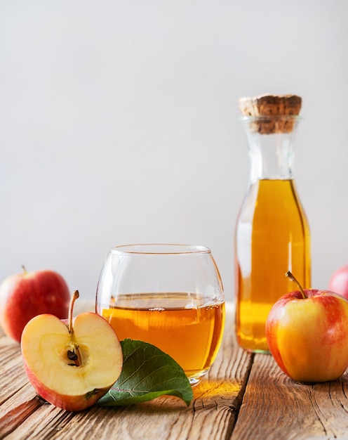 Apple juice with fresh fruits in rustic style