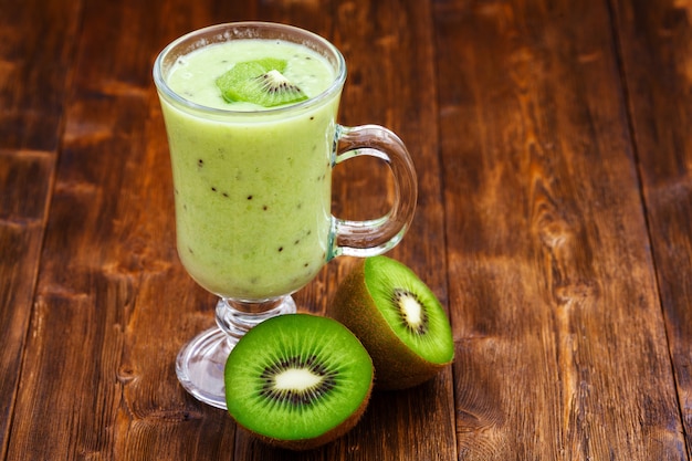 Apple and kiwi fruit milk smoothie in a glass