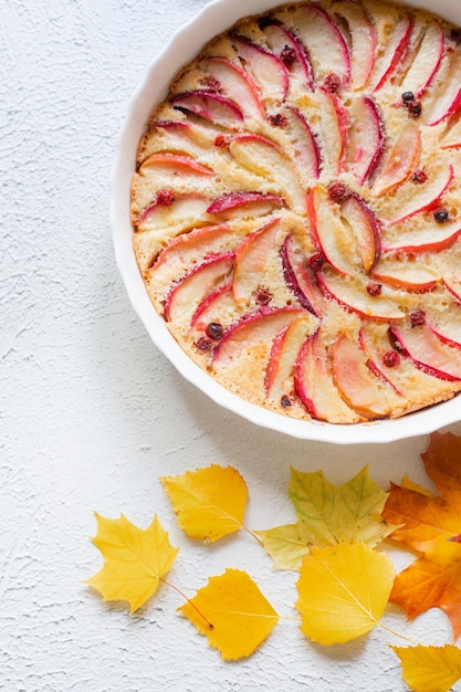 Apple pie layout and autumn leaves top view An article about autumn An article about baking Homemade cakes