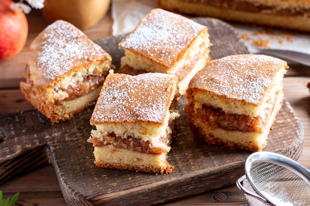 Apple pie slices traditional Hungarian version on rustic wooden background