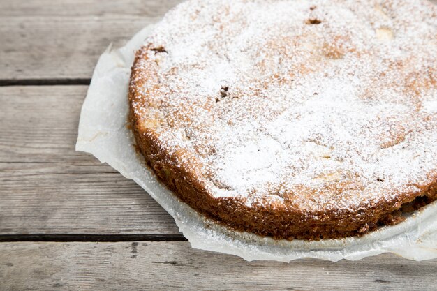 Apple pie with whole-grain flour on a wooden background. concept of healthy eating