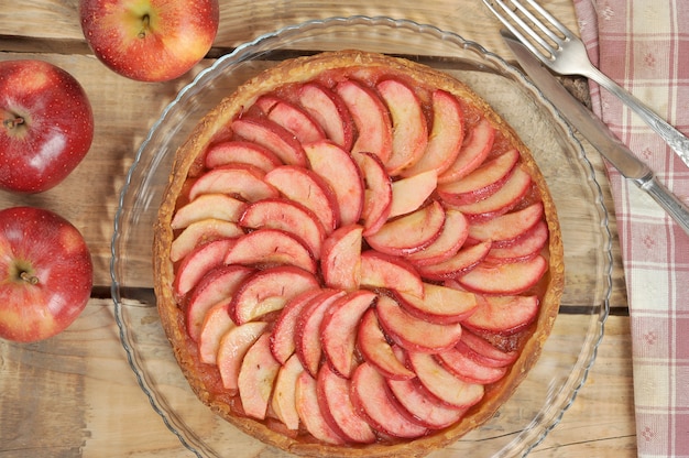 Apple pie on wooden background