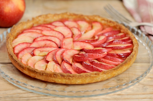 Apple pie on wooden background