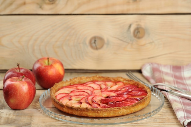 Apple pie on wooden background