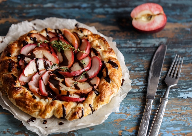 Apple pie on wooden table. Apple tart on wooden table