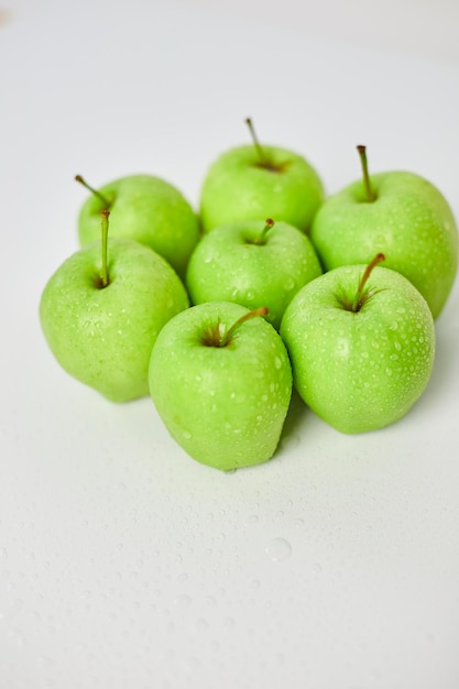 Apple ripe green apples on a white background harvest fruits concept