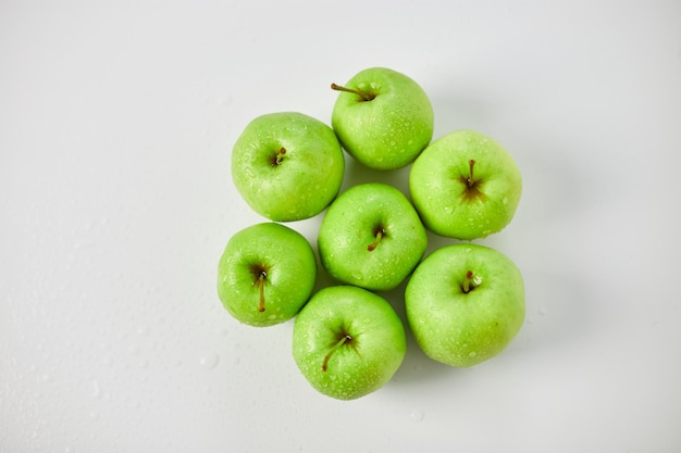 Apple ripe green apples on a white background harvest fruits concept