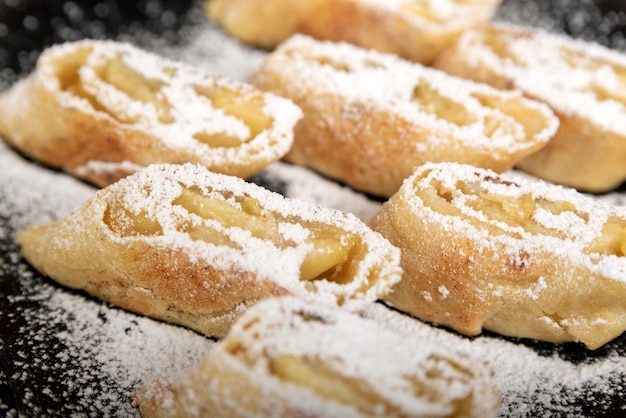 Apple roll with powdered sugar Close up