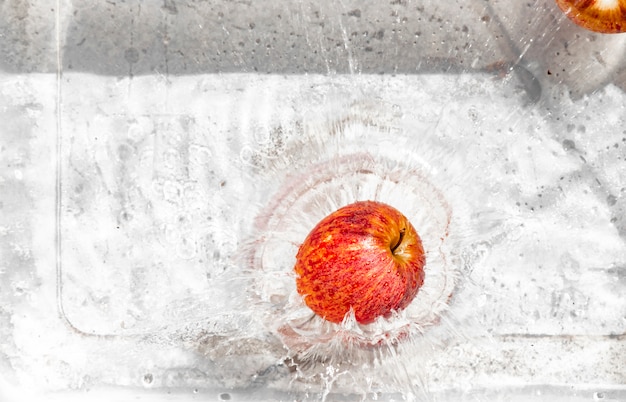 Apple splashes in water