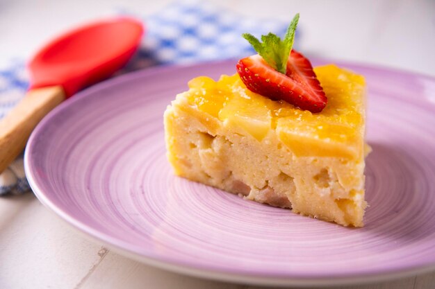 Apple sponge cake on a wooden plate.