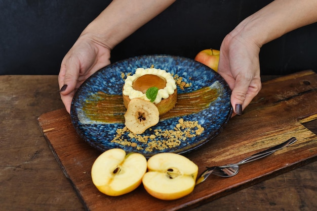 Apple tart with fresh apples on wooden table