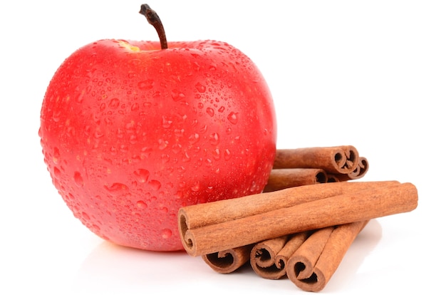 Apple with cinnamon isolated on white