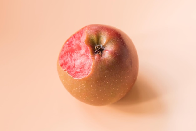 Apple with red flesh inside on a yellow background Top view Nibbled Central Asia Anthocyanin and pyrocyanidins