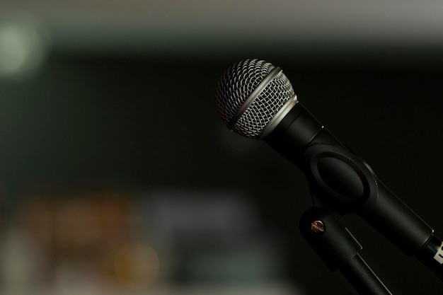 Approach to a microphone mounted on a tripod in a bar to sing or speak