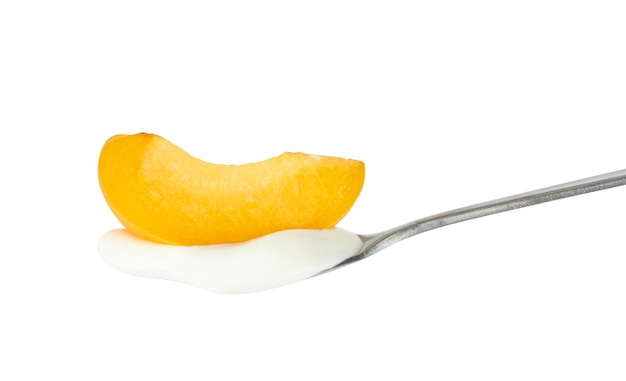 Apricot on a dessert spoon.