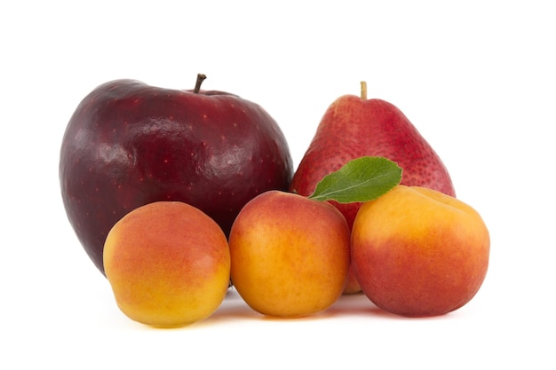 Apricots pear and red apple isolated on a white