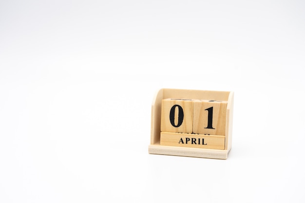 April 1st wooden calendar on vintage wood abstract background. April Fools' Day 