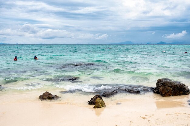 Aqua sea with sand beach in windy day