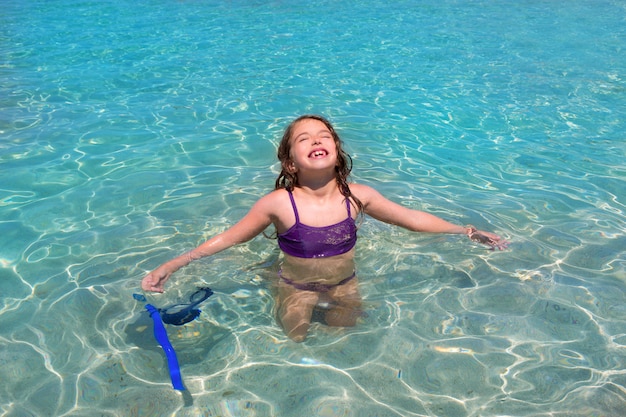 aqua water beach and open arms bikini little girl