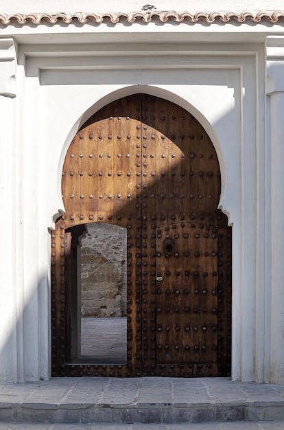 Arab architecture in the old medina. Streets, doors, windows, details. Tangier, Morocco