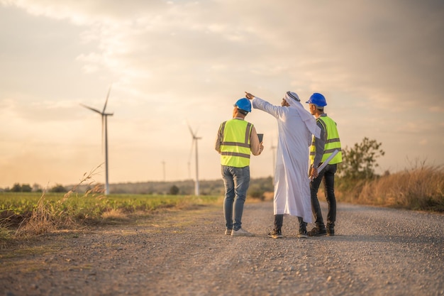 Arab busines and engineer man inspects construction of solar cell panel or photovoltaic cell by electronic device Industrial Renewable energy of green power