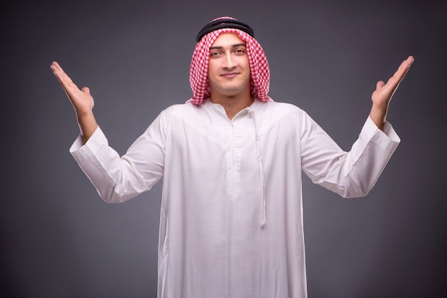 Arab businessman on gray 