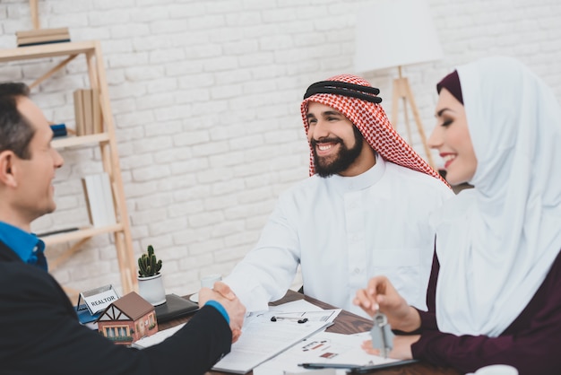 Arab Man and Woman Receiving Keys from New House.