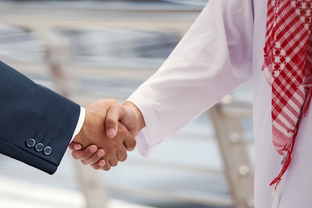 arabian business men shake hand and discuss together for success concept