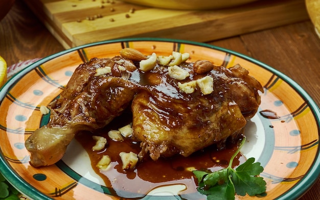 Arabian cuisine - Fasanjoon, Chicken in Pomegranate and Walnut Sauce, Top view.