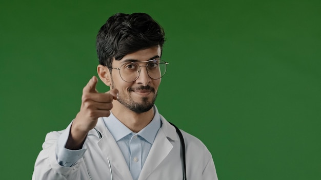 Arabic doctor man smiling hispanic male medical worker raises index finger warns you to be attentive