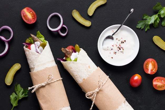 Arabic kebab sandwich on black table