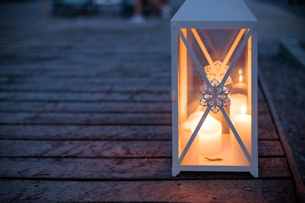 Arabic Lantern outdoorBurning candle Candlelight in the darkcandles at nightRomantic background or greeting cardromantic evening at the beach Mystical scene