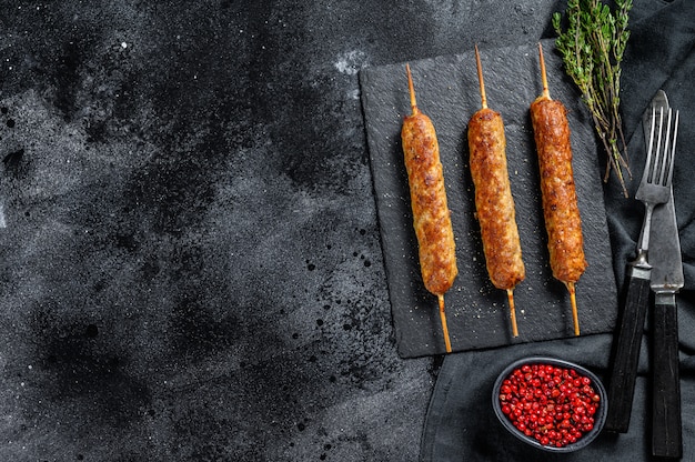 Arabic Traditional kebabs in a black board