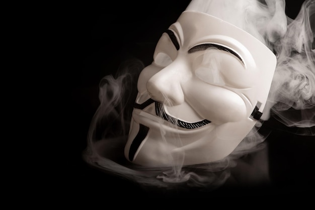 Araras Sao Paulo Brazil May 27 2024 V for Vendetta mask on a dark background with smoke selective focus