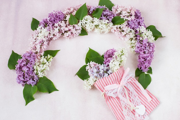  arch of lilacs and a bouquet of lilacs in a bag