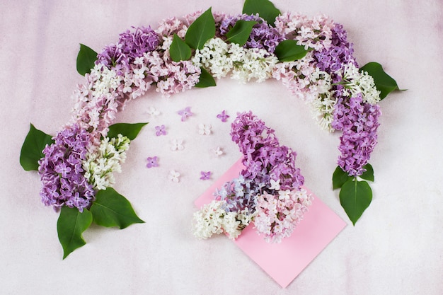  arch of lilacs and a bouquet of lilacs in an envelope