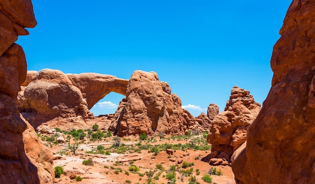 Arch between rocky mountains