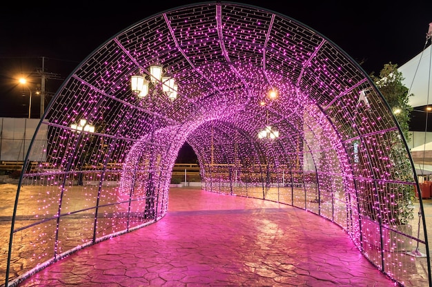 Arch tunnel walkway decorated with pink light