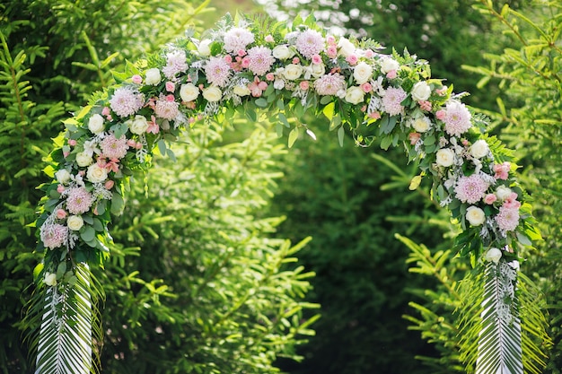 Arch at a wedding ceremony made of flowers